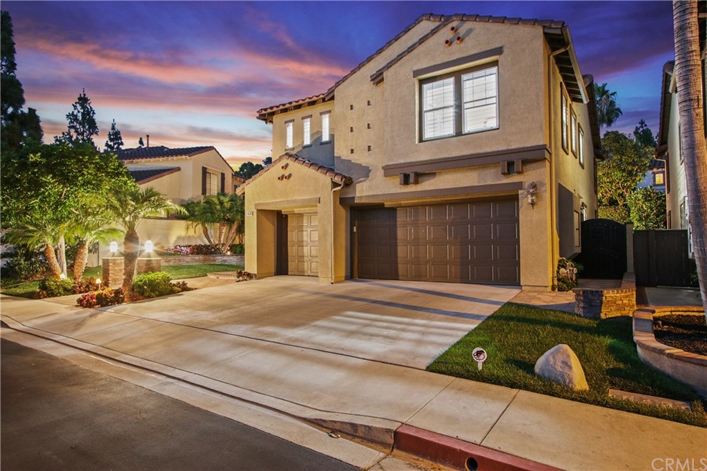 11610 Goetting Avenue Tustin, CA 92782 - Photo 49 of 62 a front view of a house with yard