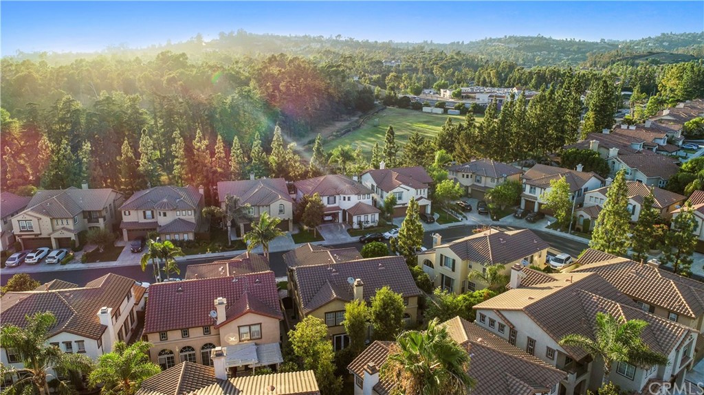 11610 Goetting Avenue Tustin, CA 92782 - Photo 57 of 62 an aerial view of residential houses with outdoor space