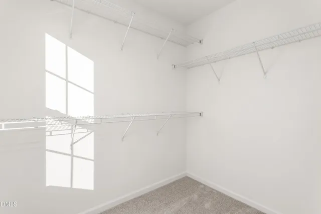 a bathroom with a sink double vanity granite tub and a mirror
