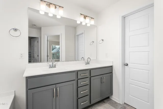 a bathroom with a glass shower door