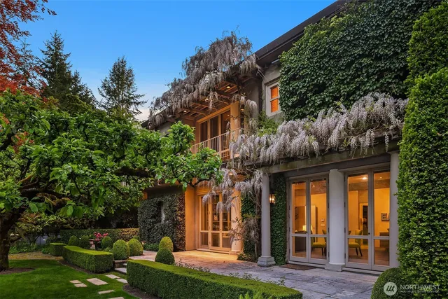 a front view of a house with a garden