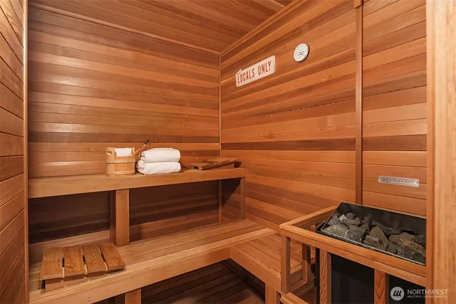 a view of a garden with flowers and trees