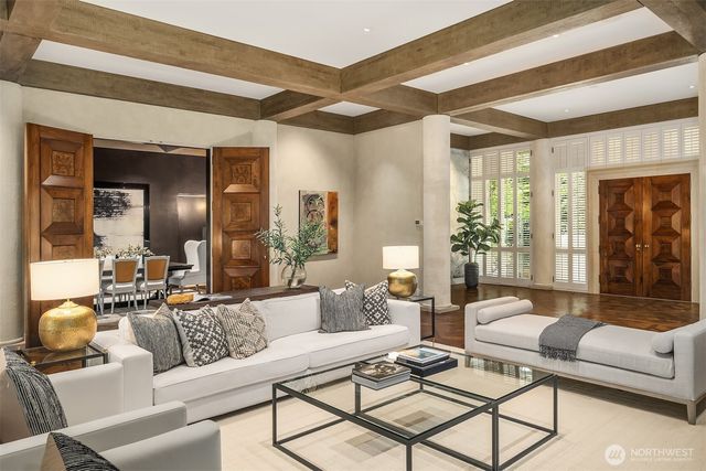 a vase of flowers sitting next to a window