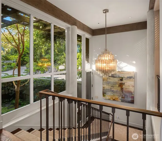 a dining room with furniture a rug and a painting