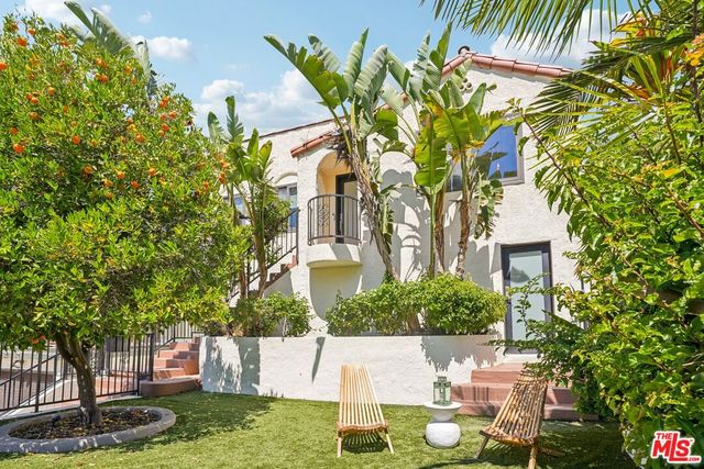 a view of a chair and table in the yard