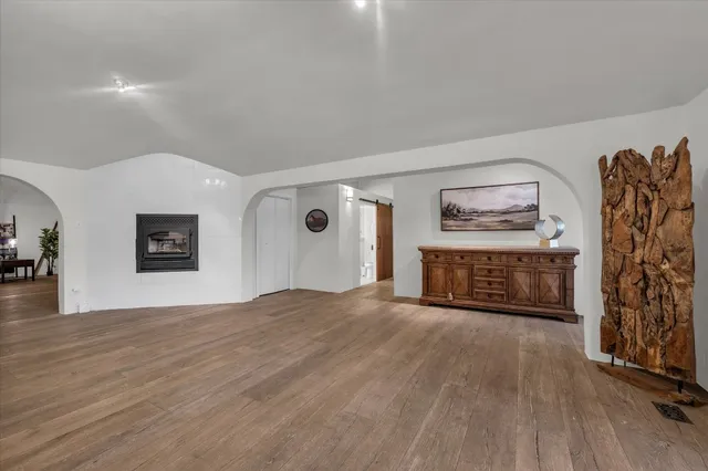 a kitchen with stainless steel appliances granite countertop a sink a stove and a refrigerator