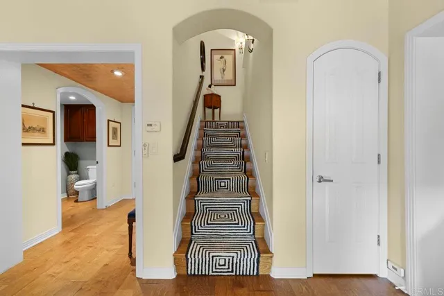 a view of a livingroom with furniture and staircase