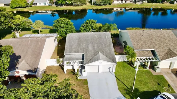 an aerial view of a house with a lake view