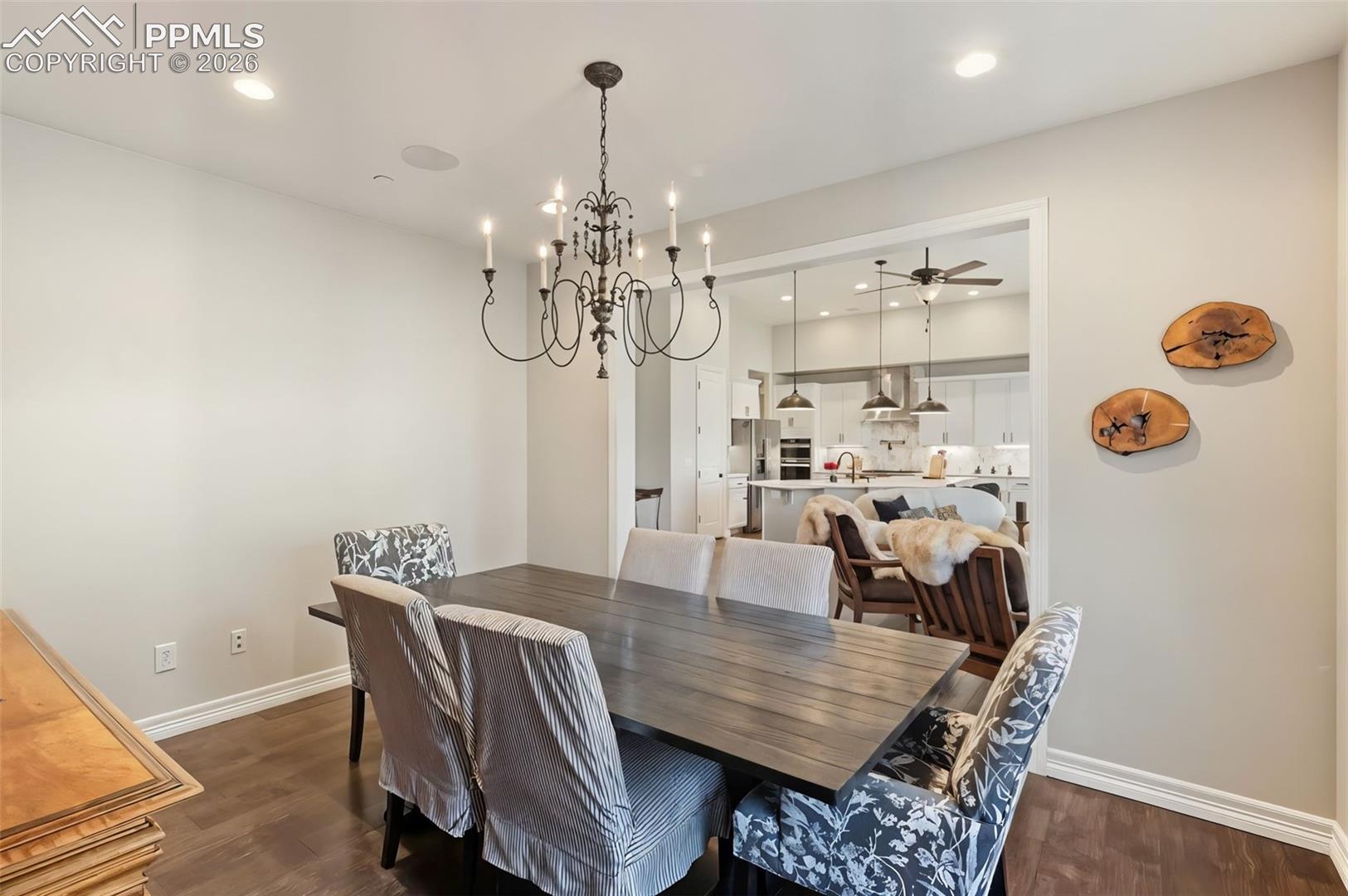 5318 Rocking Tree Grove Colorado Springs, CO 80906 - Photo 11 of 49 With easy proximity to the kitchen, the dining area ensures hot dishes arrive flawlessly at the table, while the wide architectural archways prevent the space from feeling isolated
