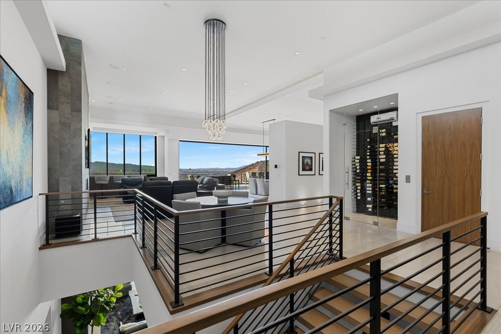 657 Ridgestone Rim Court Henderson, NV 89012 - Photo 13 of 97 Clean modern lines frame a spacious upper level featuring polished tile floors and soaring ceilings.