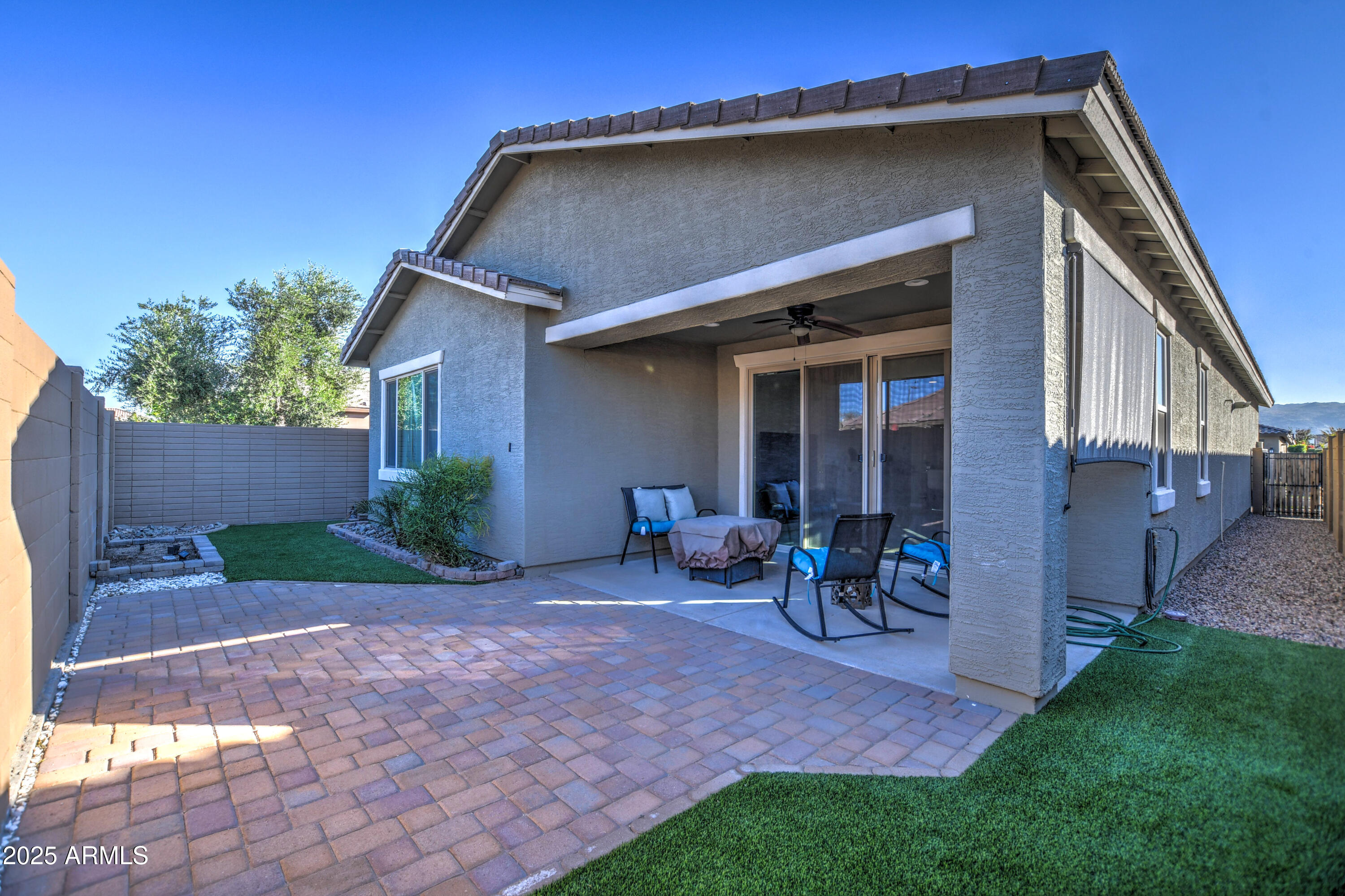 2842 East Fraktur Road Phoenix, AZ 85040 - Photo 13 of 46 a front view of a house with garden and chairs