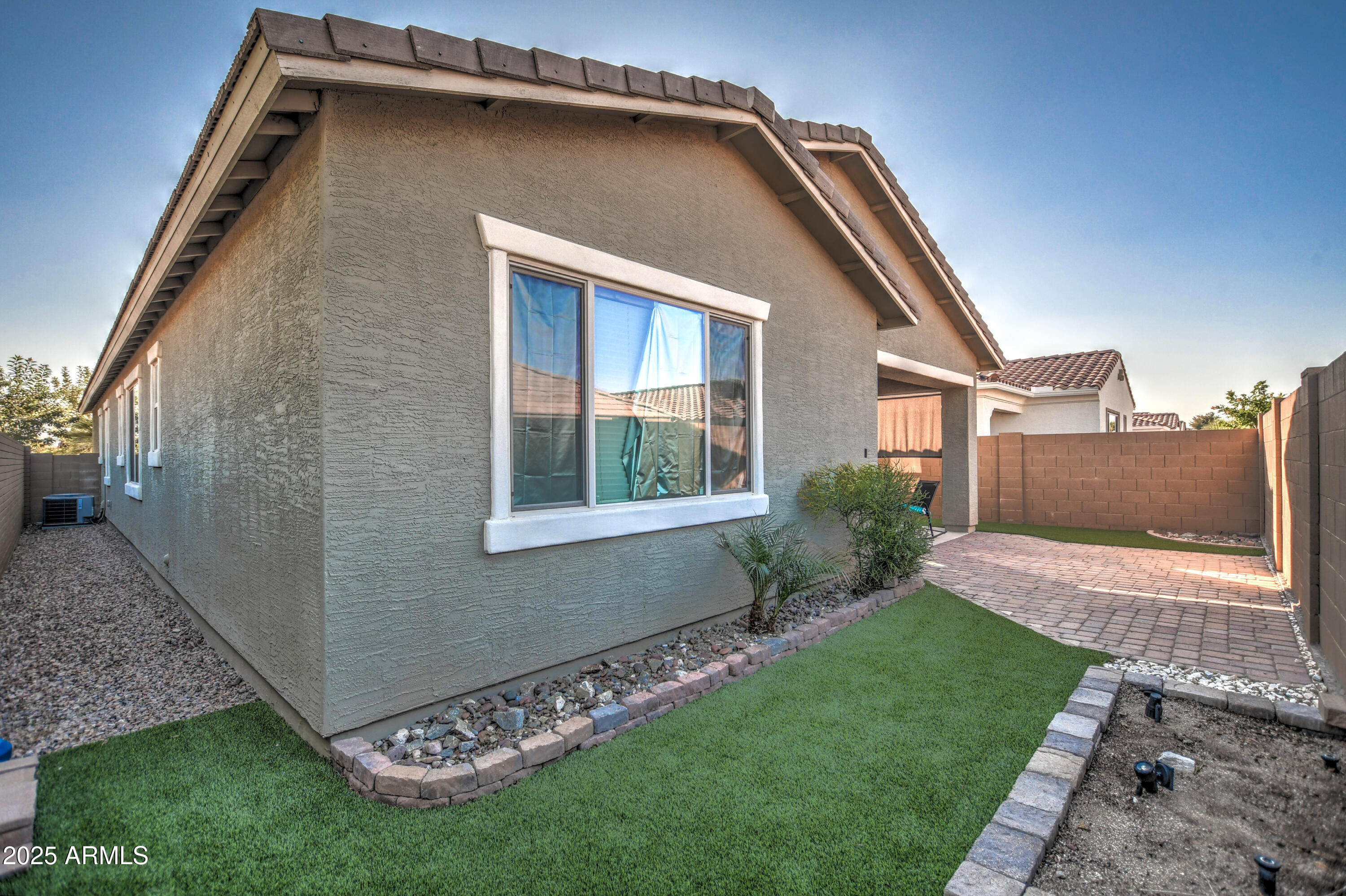 2842 East Fraktur Road Phoenix, AZ 85040 - Photo 14 of 46 a front view of a house with a garden and yard