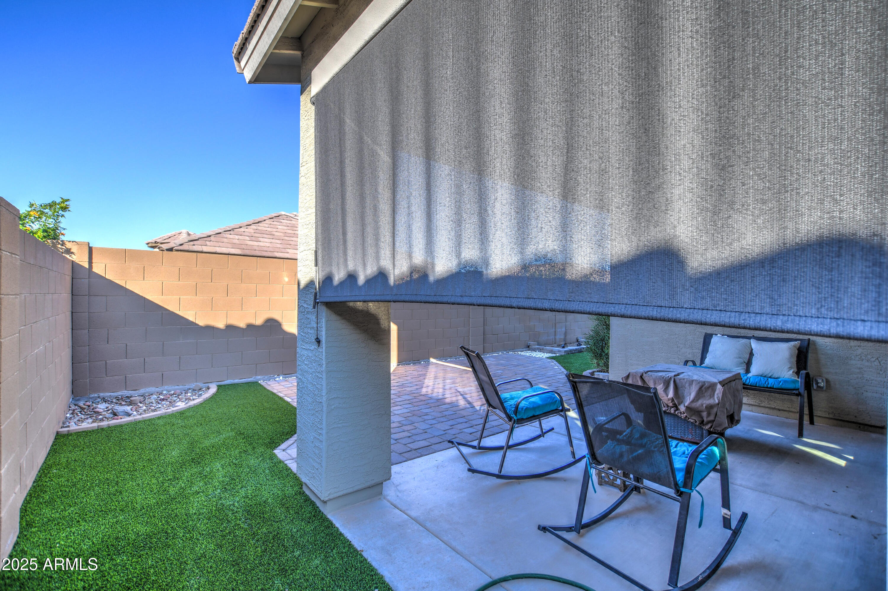 2842 East Fraktur Road Phoenix, AZ 85040 - Photo 17 of 46 a view of a chairs and table in patio with a backyard