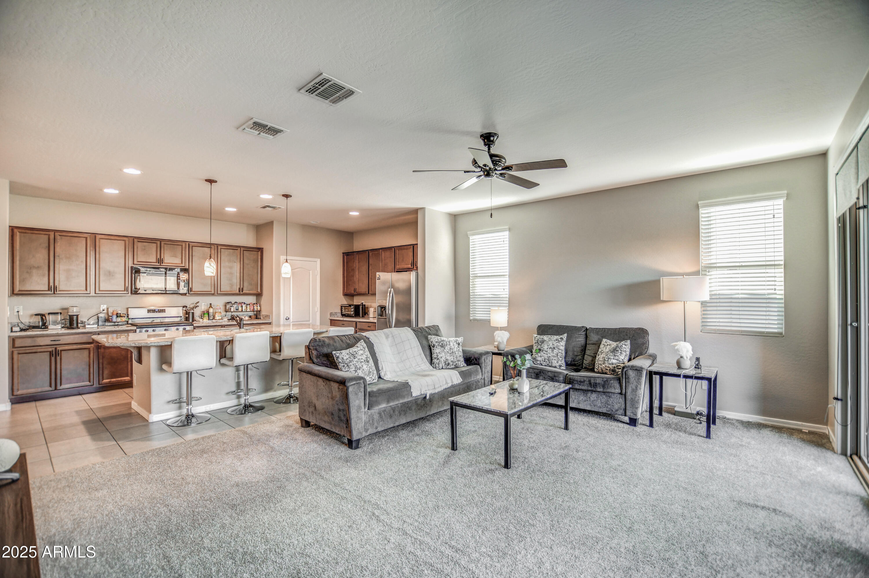 2842 East Fraktur Road Phoenix, AZ 85040 - Photo 18 of 46 a living room with furniture and a view of kitchen