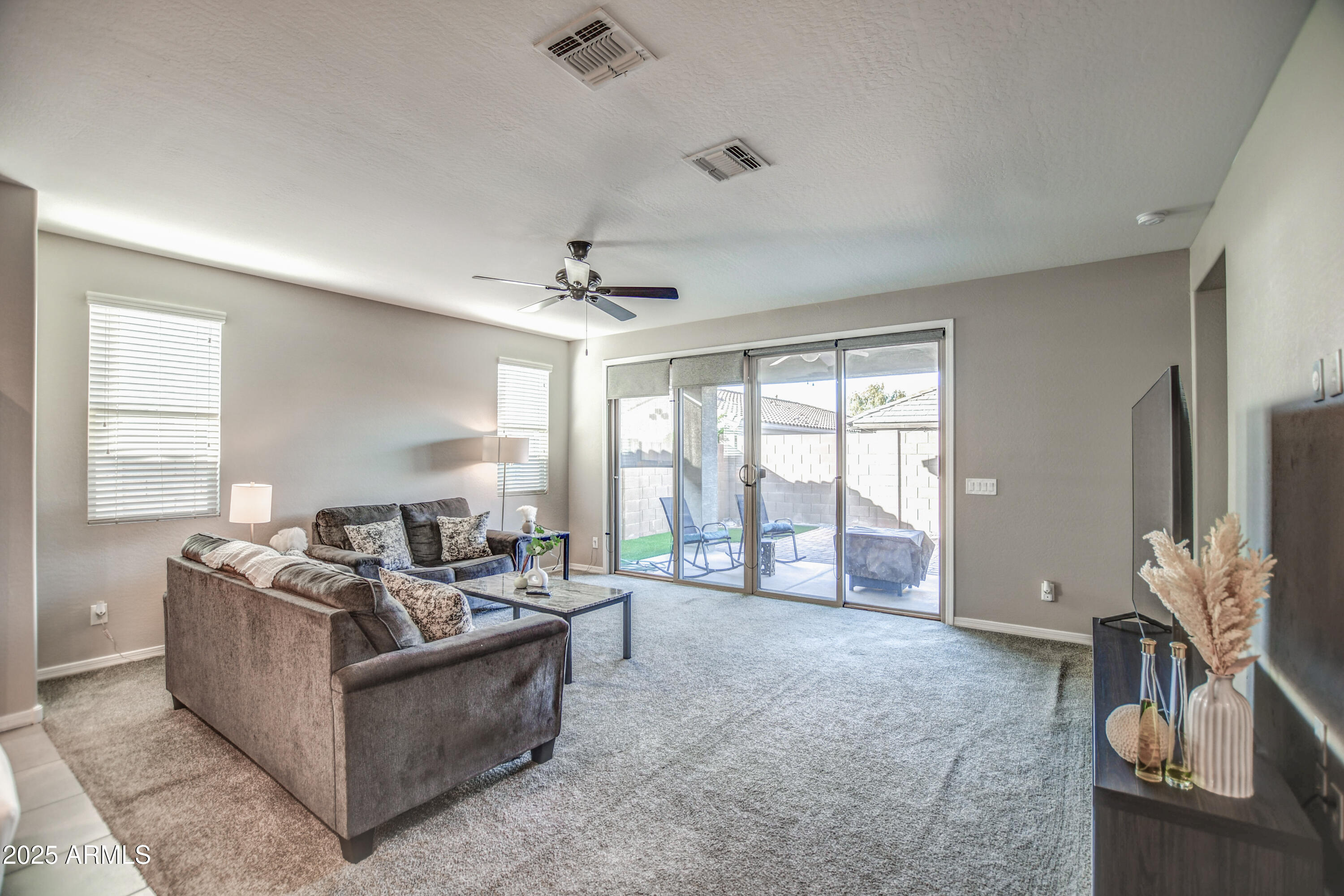 2842 East Fraktur Road Phoenix, AZ 85040 - Photo 19 of 46 a living room with furniture and a flat screen tv