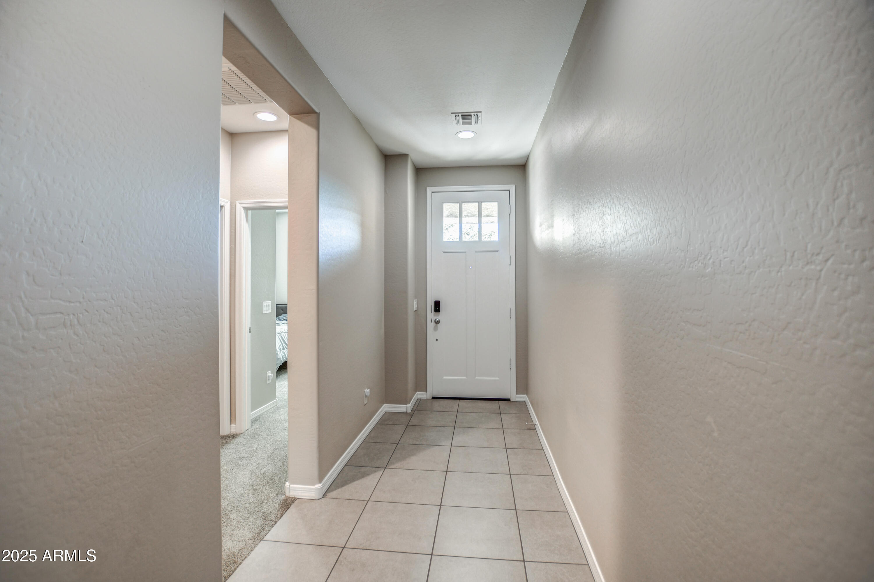 2842 East Fraktur Road Phoenix, AZ 85040 - Photo 2 of 46 a view of a hallway with wooden floor