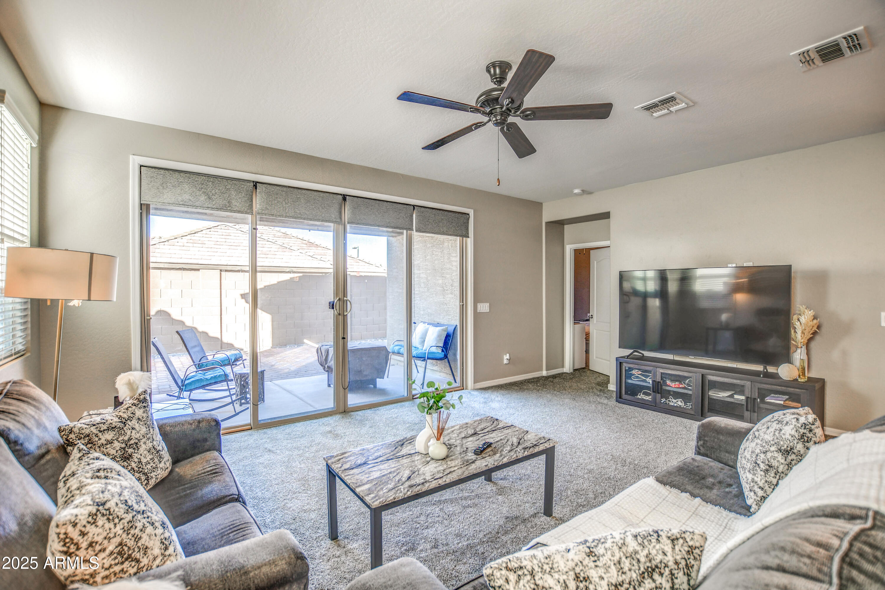 2842 East Fraktur Road Phoenix, AZ 85040 - Photo 21 of 46 a living room with furniture and a flat screen tv