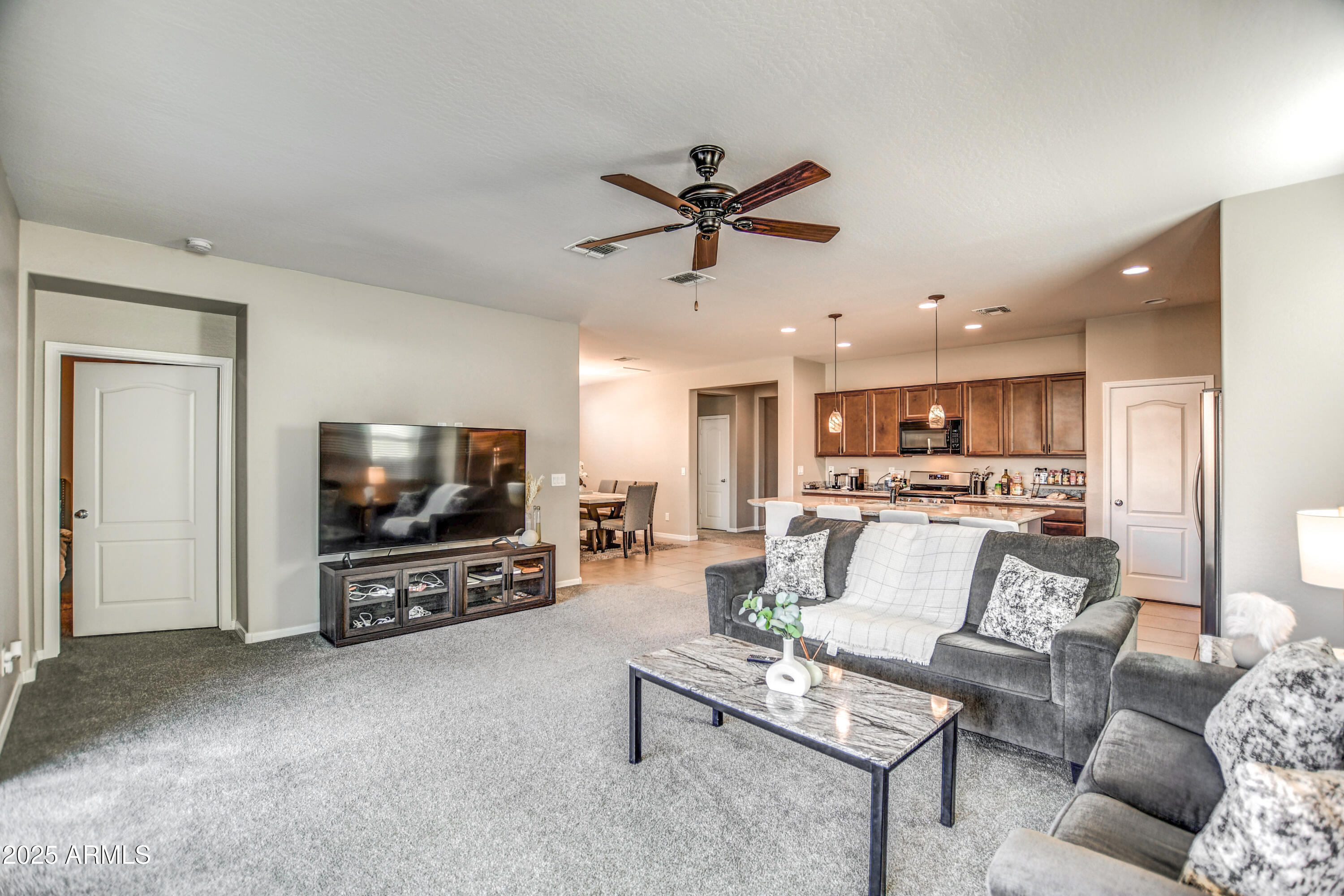 2842 East Fraktur Road Phoenix, AZ 85040 - Photo 35 of 46 a living room with furniture and a flat screen tv