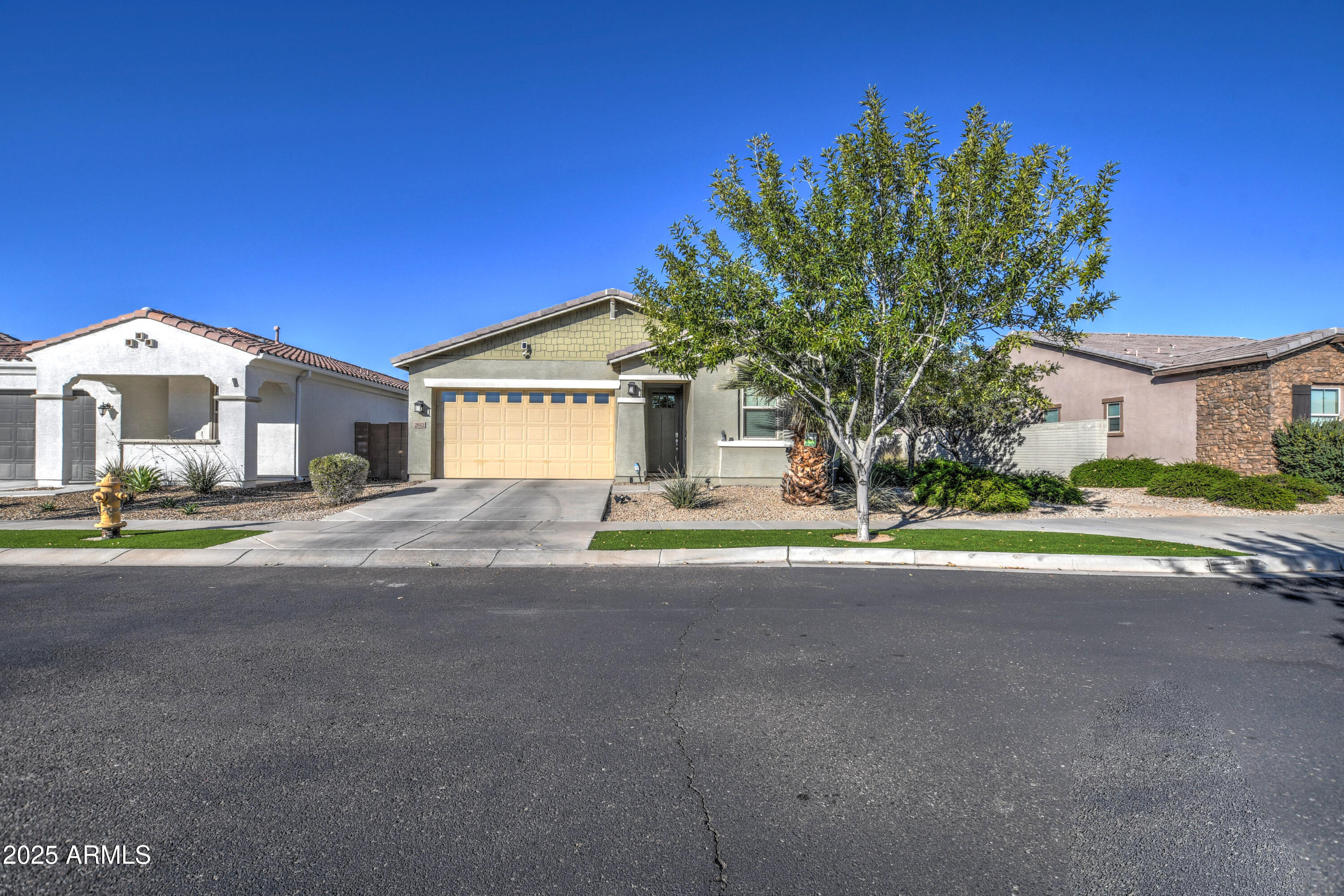 2842 East Fraktur Road Phoenix, AZ 85040 - Photo 36 of 46 a front view of a house with a yard and garage