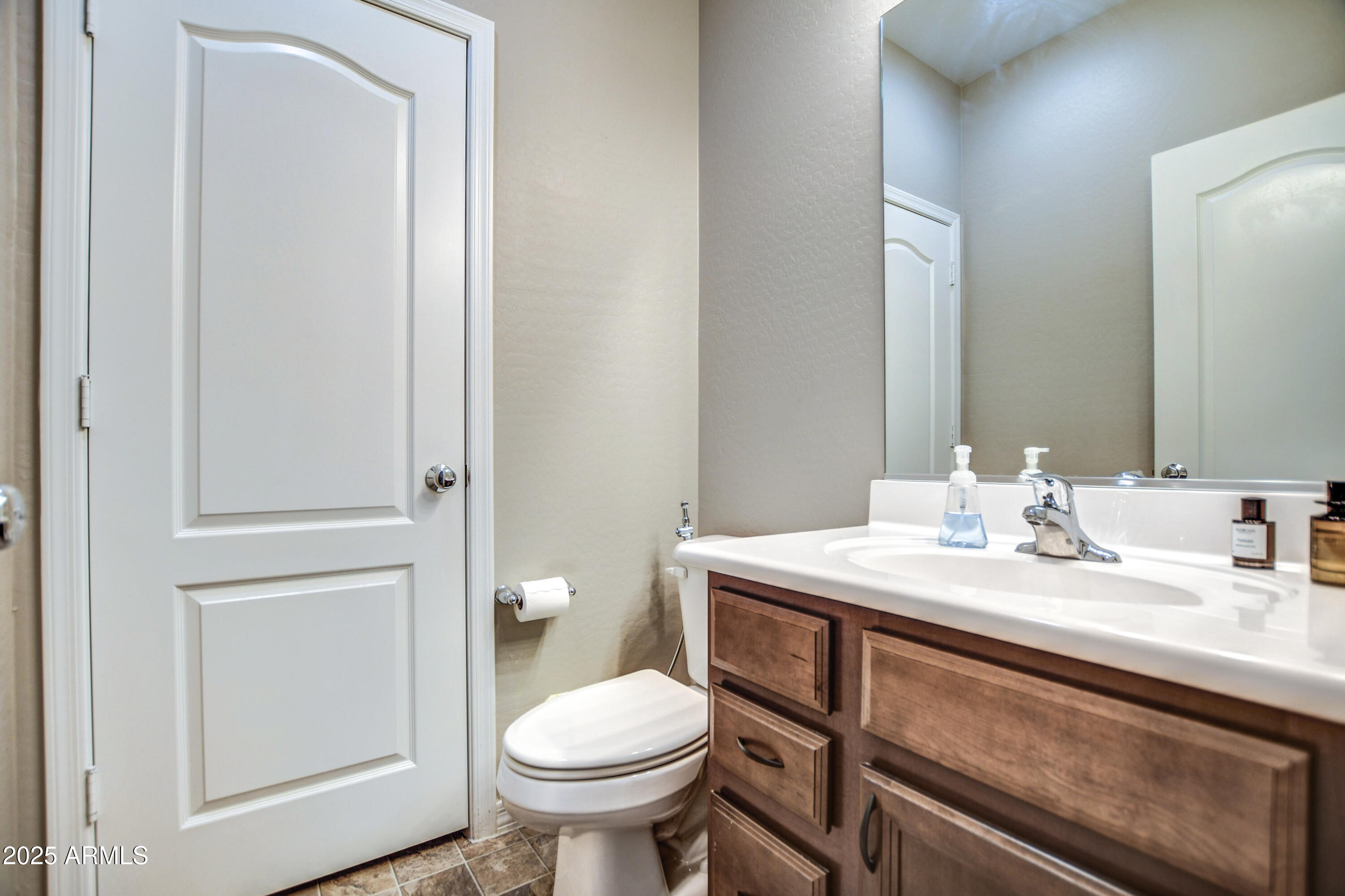 2842 East Fraktur Road Phoenix, AZ 85040 - Photo 39 of 46 a bathroom with a sink toilet and vanity