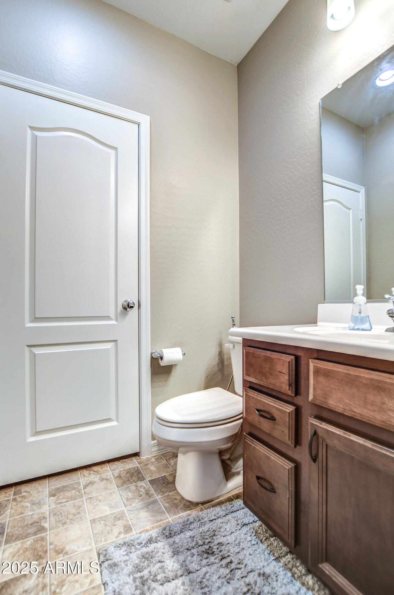 2842 East Fraktur Road Phoenix, AZ 85040 - Photo 40 of 46 a bathroom with a toilet sink and mirror