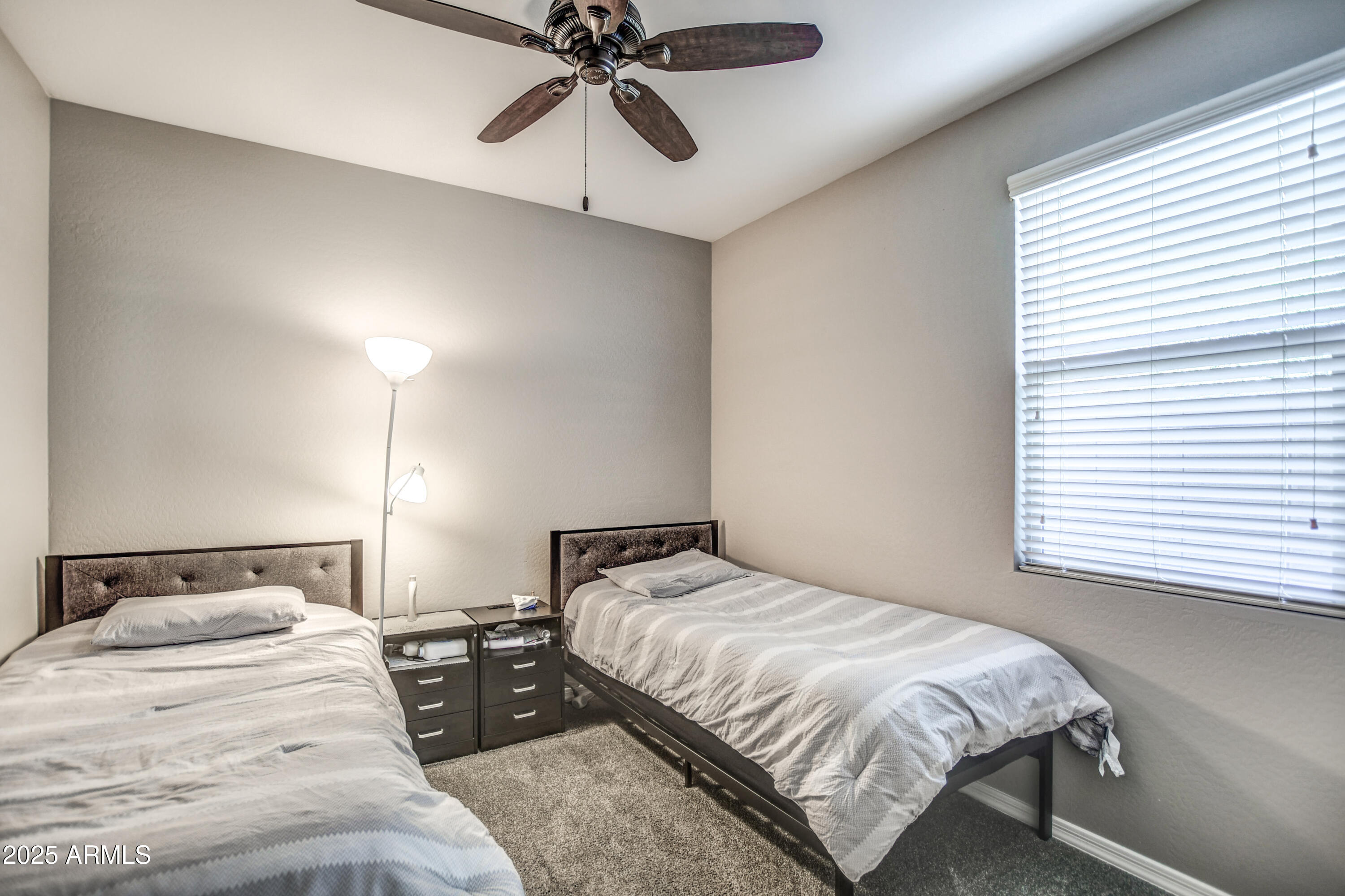 2842 East Fraktur Road Phoenix, AZ 85040 - Photo 4 of 46 a bedroom with a bed and window