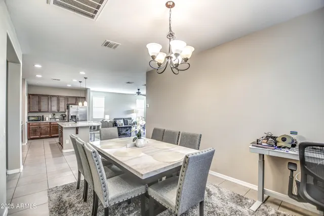 a bedroom with a bed and a refrigerator