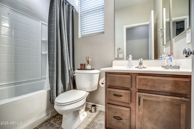 a bathroom with a toilet a sink and bathtub