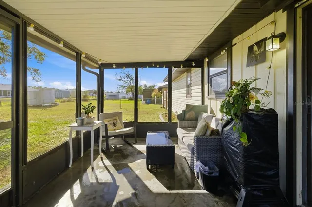 a living room with large windows