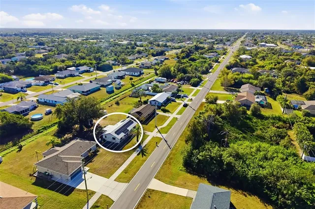 an aerial view of residential houses with outdoor space