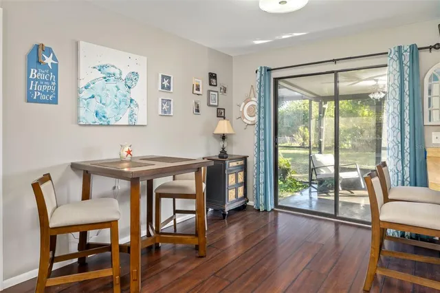 a view of a livingroom with furniture window and wooden floor