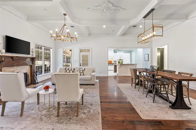 a view of a dining area with furniture window and wooden floor