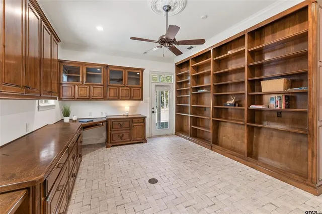 a large kitchen with stainless steel appliances a cabinets and a counter top space