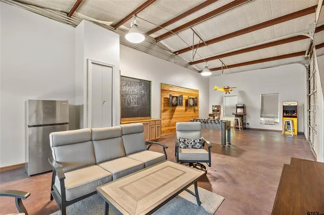 a living room with furniture and a table