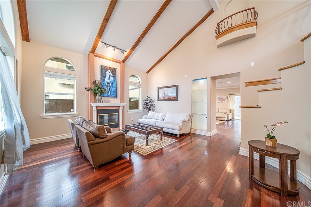 5237 Temple City Boulevard Temple City, CA 91780 - Photo 3 of 23 a living room with fireplace furniture and a wooden floor