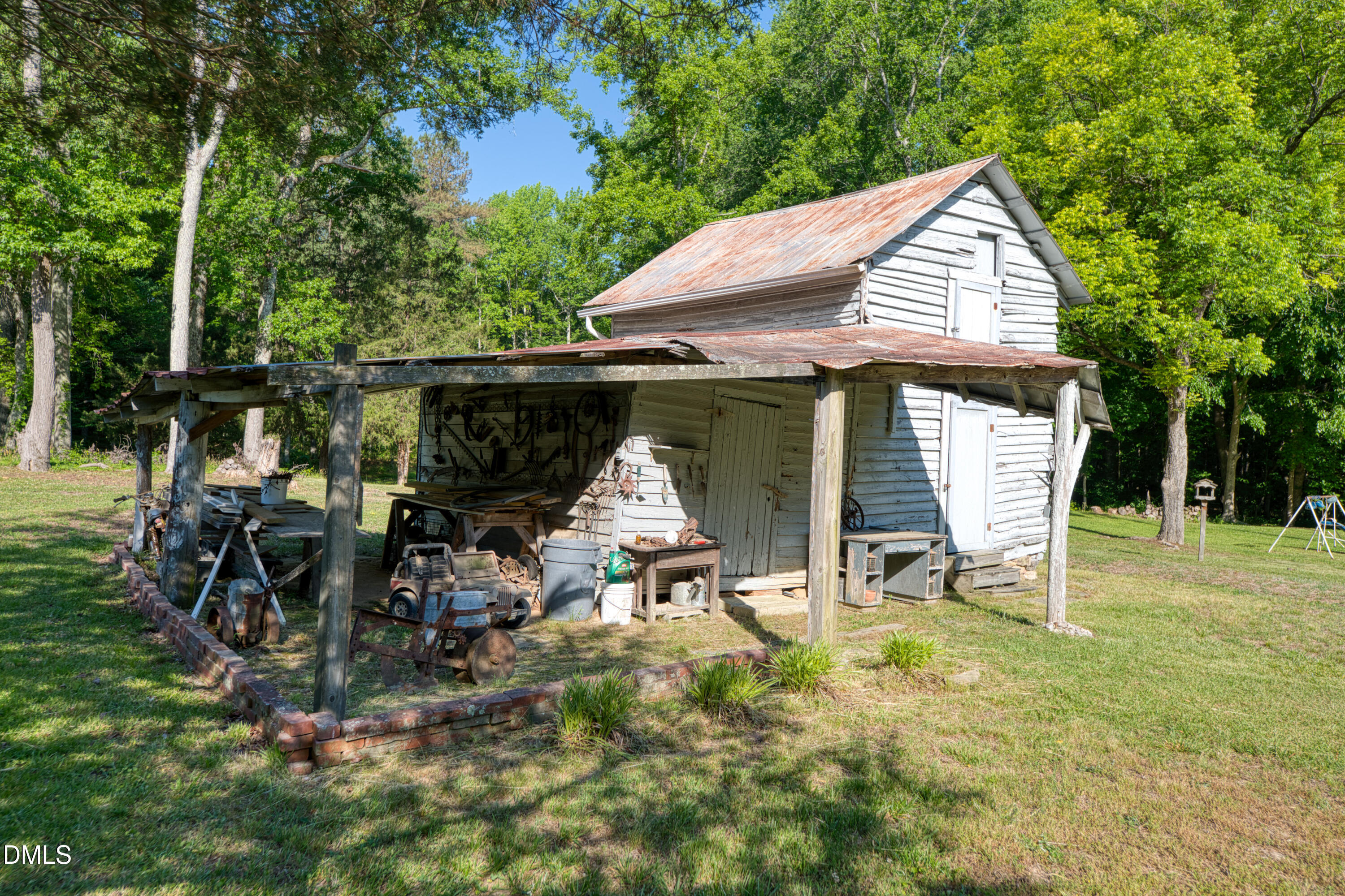 50 Robert Sledge Road Spring Hope, NC 27882 - Photo 34 of 50 an outdoor space with furniture and garden