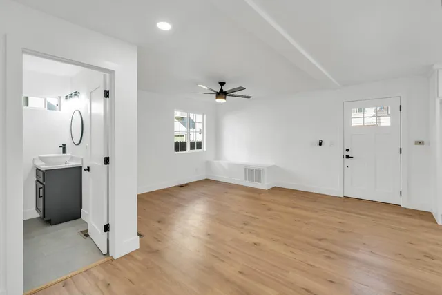 a kitchen with cabinets appliances and a sink