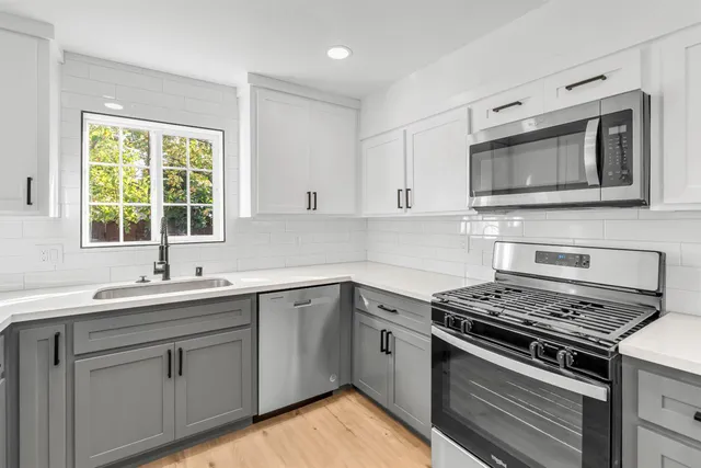 a bathroom with a shower a toilet and sink