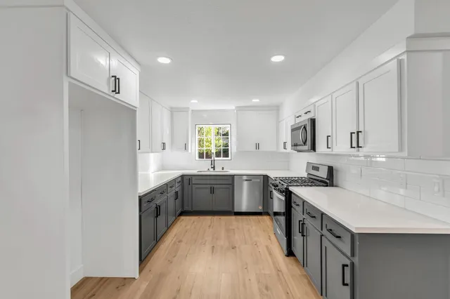 a view of a livingroom with wooden floor