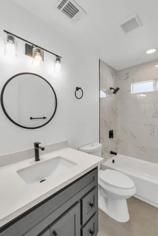 a view of an empty room and wooden floor
