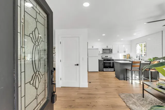 a living room with furniture and a large window