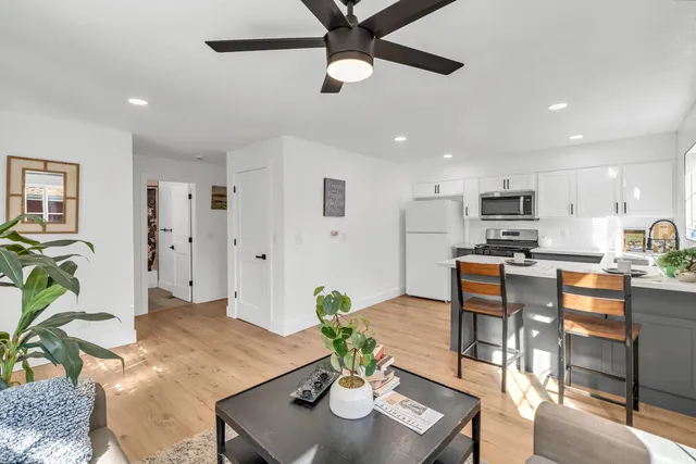 a kitchen with a stove microwave and sink