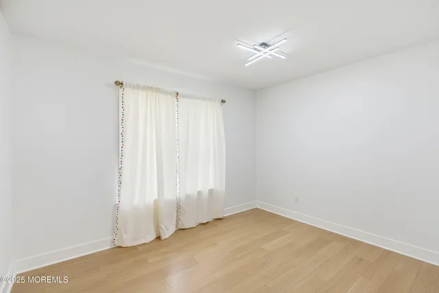 a bathroom with a double vanity sink mirror and bathtub