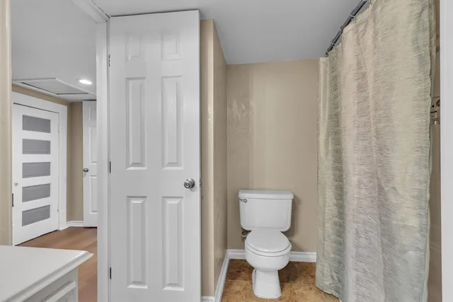 a bathroom with a toilet and a sink