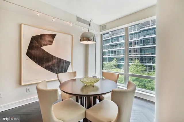 a view of a dining room with furniture window and outside view