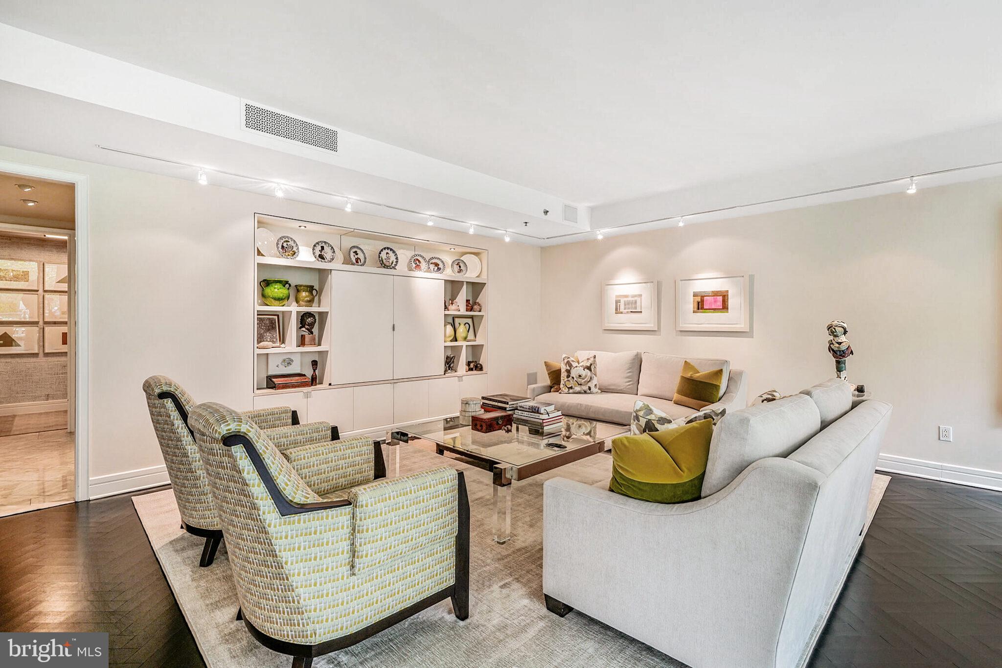 1111 23rd Street Northwest, Unit 4F Washington, DC 20037 - Photo 7 of 27 a living room with fireplace furniture and a wooden floor