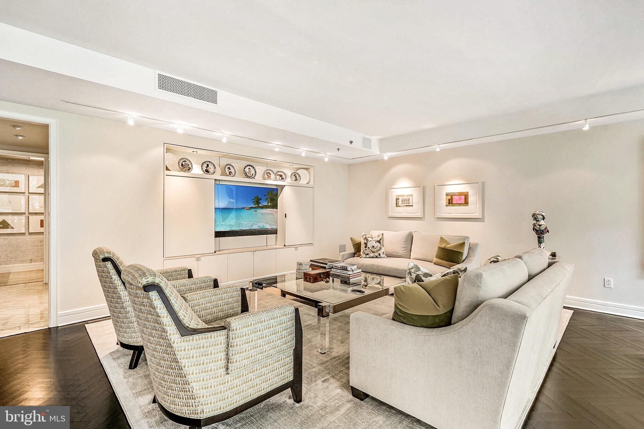 1111 23rd Street Northwest, Unit 4F Washington, DC 20037 - Photo 8 of 27 a living room with furniture and a flat screen tv