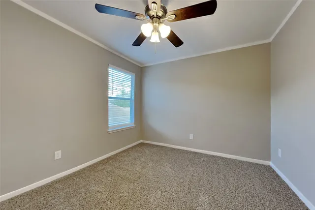an empty room with closet and window