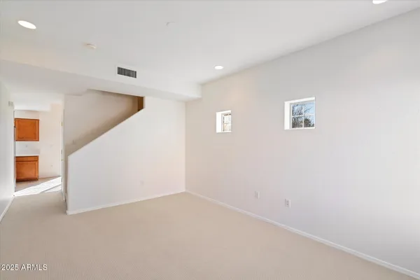 a view of a hallway with staircase