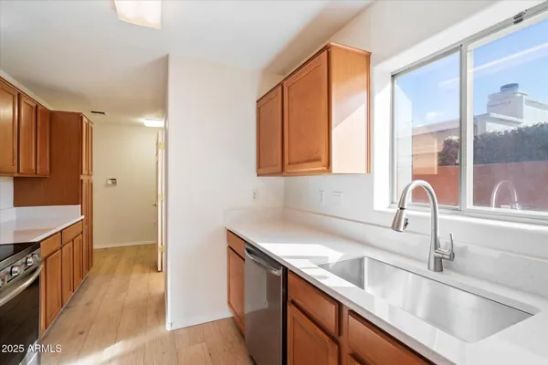 a kitchen with a sink and a counter top space